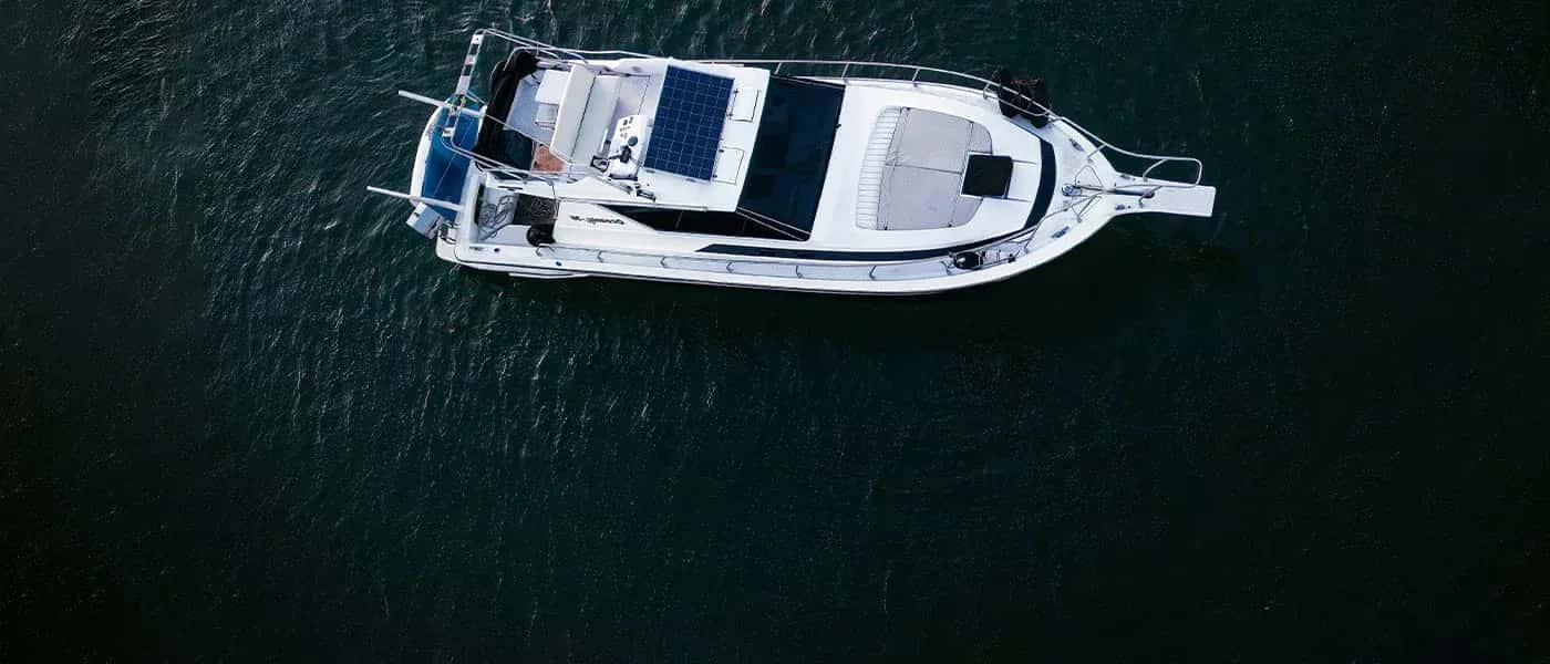 A yacht cruising off the Dubai Marina skyline
