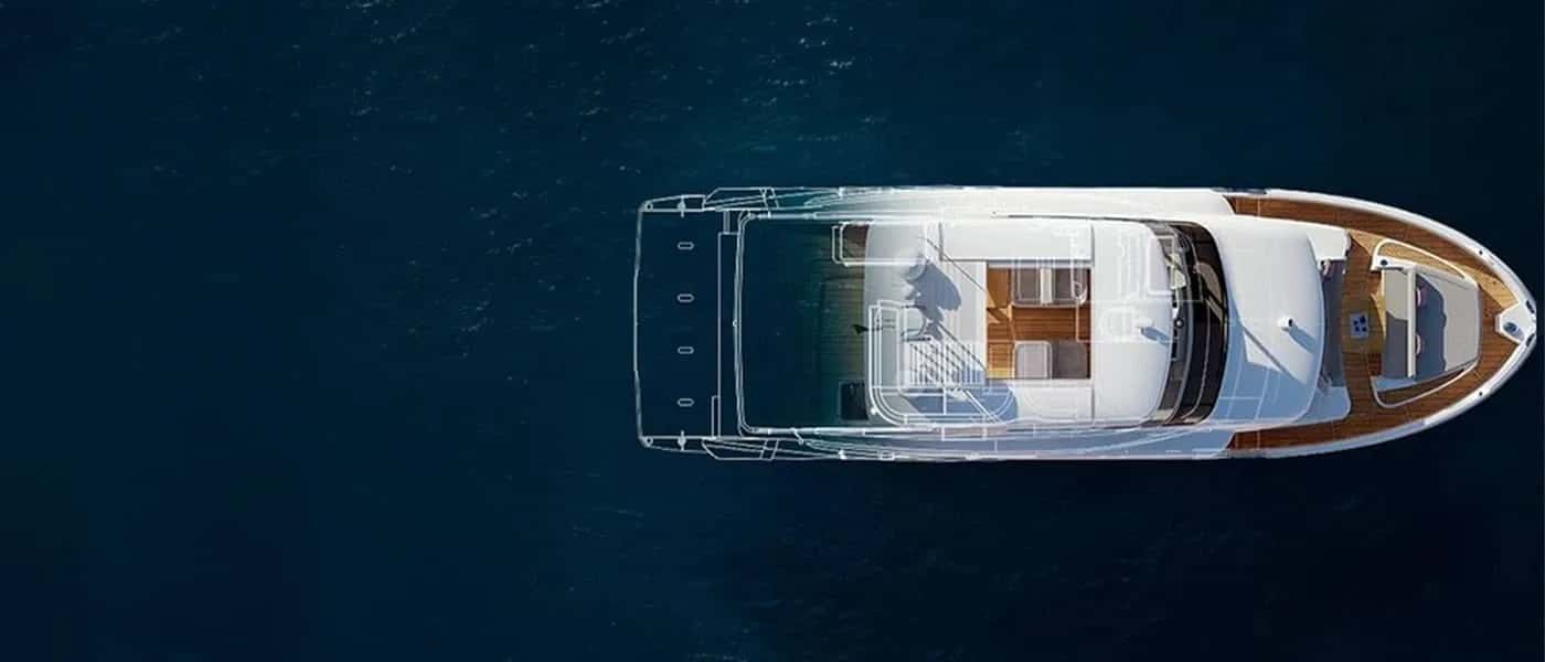 A yacht seen from above on deep blue water