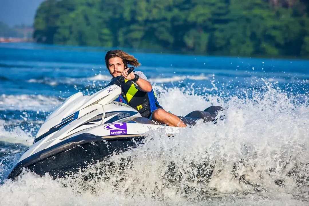 A guest on a jet ski beside the yacht